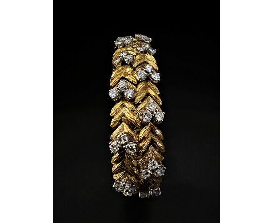 Bracciale  con  orologio  a scomparsa  firmato  " EBEL " 
