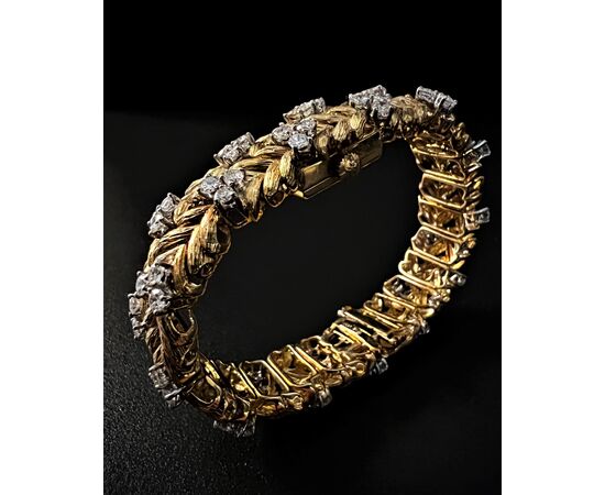 Bracciale  con  orologio  a scomparsa  firmato  " EBEL " 