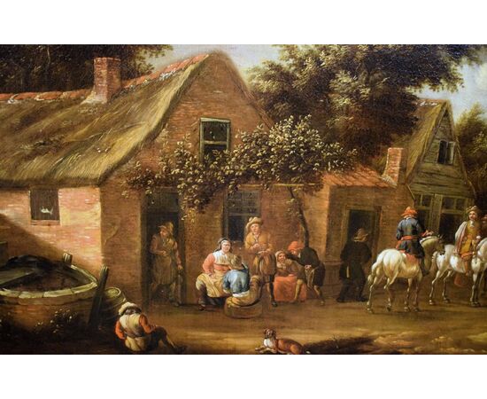 Personaggi e cavalieri nel cortile dell'osteria.