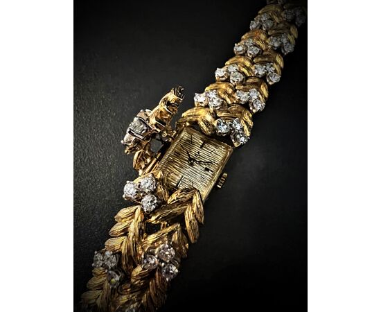 Bracciale  con  orologio  a scomparsa  firmato  " EBEL " 