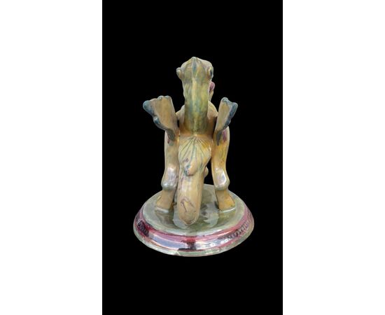 Candeliere - bugia in maiolica a lustro a forma di grifone alato.Societa’Ceramica Umbra.Gualdo Tadino.