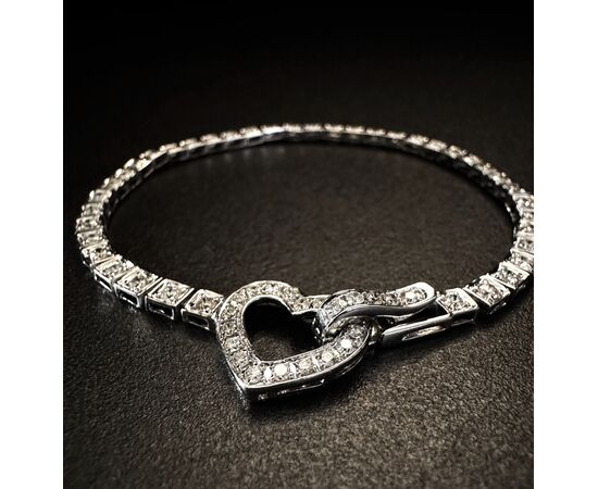 Bracciale  tennis  in  oro  bianco  con  chiusura a cuore 