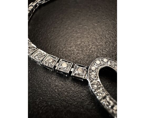Bracciale  tennis  in  oro  bianco  con  chiusura a cuore 