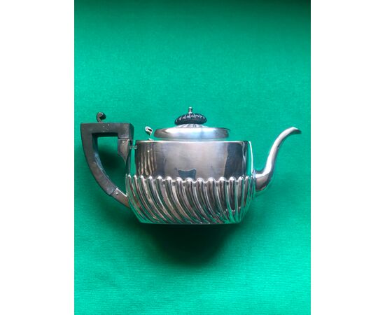 Silver teapot with art nouveau decorative motifs and ebony wood handle.Sheffield, England 1907.     