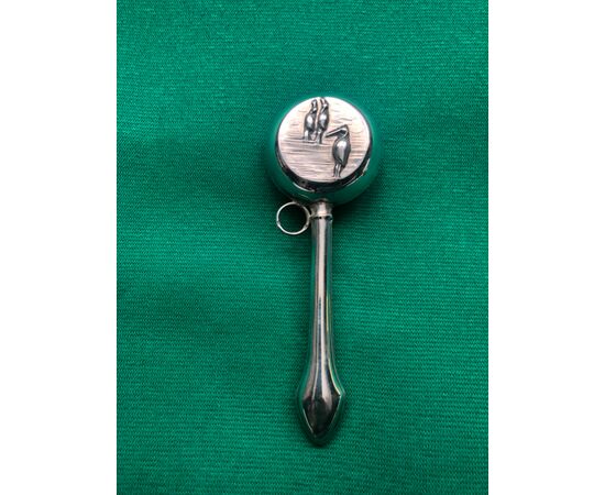 Silver baby rattle with lake scene and herons.     