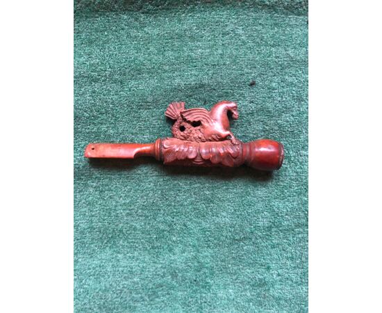 Boxwood pipe engraved with a fantastic animal figure and stylized plant elements.     