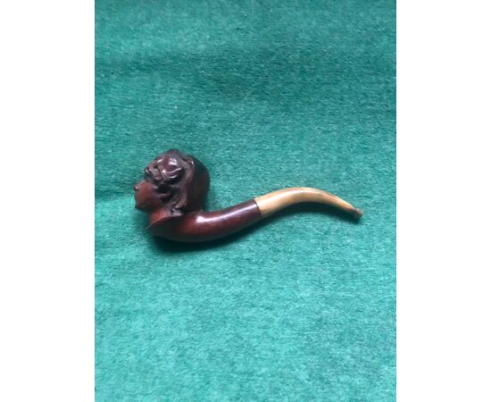 Briar and horn pipe depicting a female winner.     
