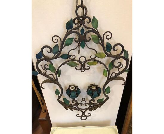 Pair of wrought iron chandeliers