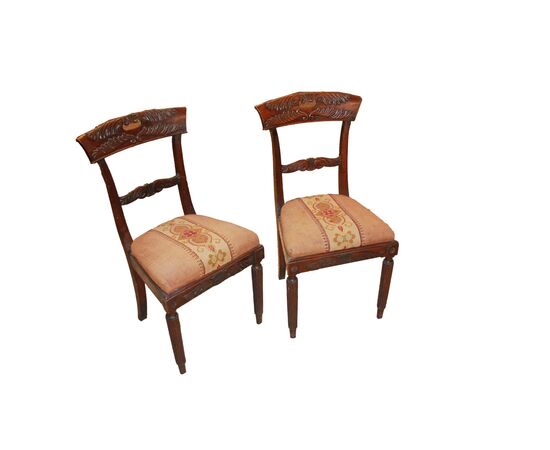 Set of 4 French Empire style chairs with richly carved backrests