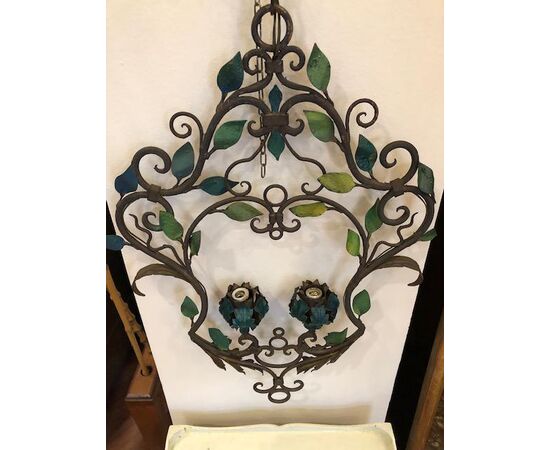 Pair of wrought iron chandeliers