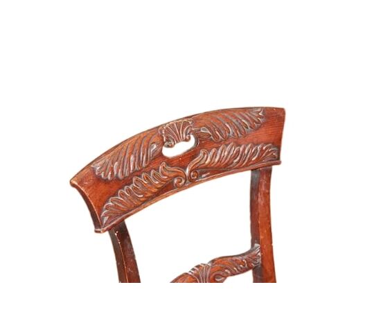 Set of 4 French Empire style chairs with richly carved backrests