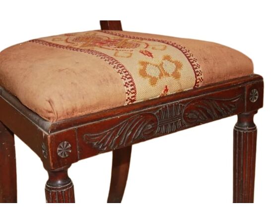 Set of 4 French Empire style chairs with richly carved backrests