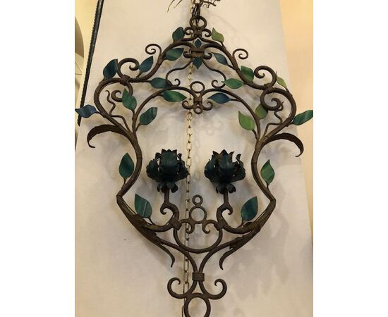 Pair of wrought iron chandeliers