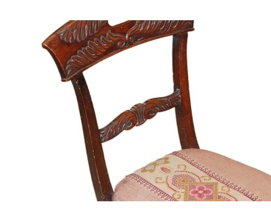 Set of 4 French Empire style chairs with richly carved backrests