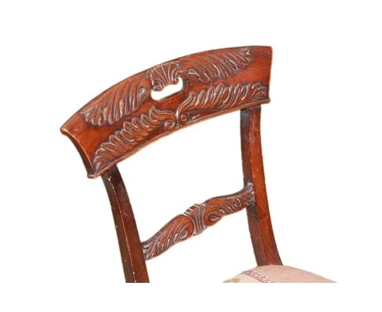Set of 4 French Empire style chairs with richly carved backrests