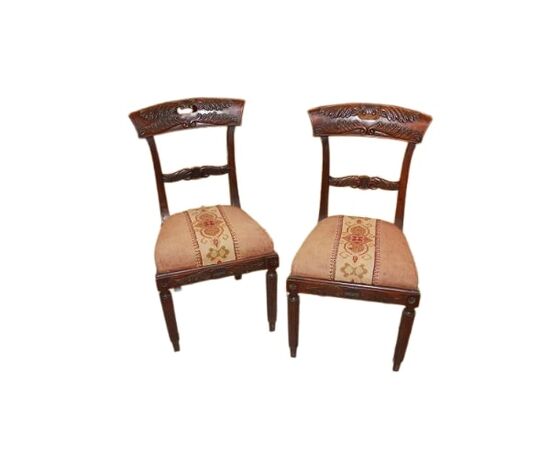 Set of 4 French Empire style chairs with richly carved backrests