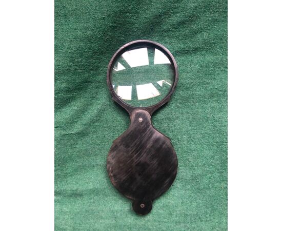 Magnifying glass in dark horn.     