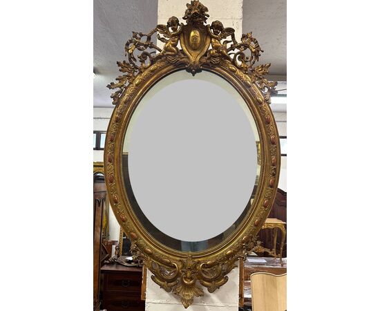 Specchiera lombarda ovale legno intagliato dorato. Primi 800. 155 x 98