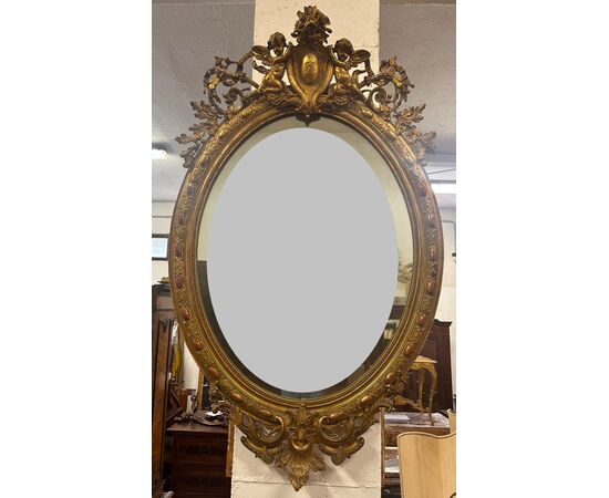 Specchiera lombarda ovale legno intagliato dorato. Primi 800. 155 x 98