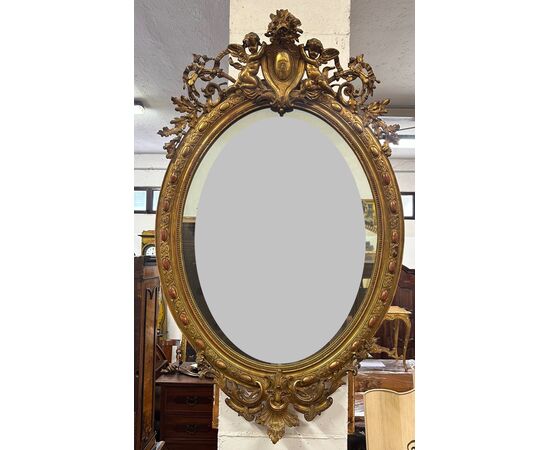 Specchiera lombarda ovale legno intagliato dorato. Primi 800. 155 x 98
