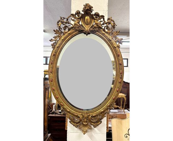 Specchiera lombarda ovale legno intagliato dorato. Primi 800. 155 x 98