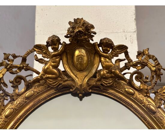 Specchiera lombarda ovale legno intagliato dorato. Primi 800. 155 x 98