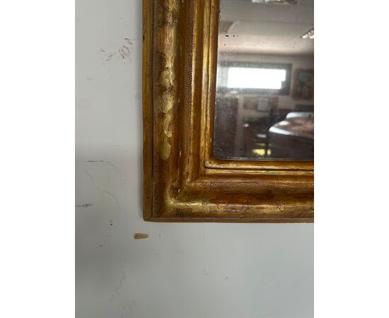 Specchiera in legno intagliato e dorato. Lombardia fine 700