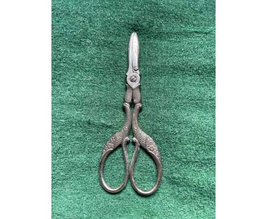 Metal midwife scissors for metal umbilical cord decorated with stylized stork.     