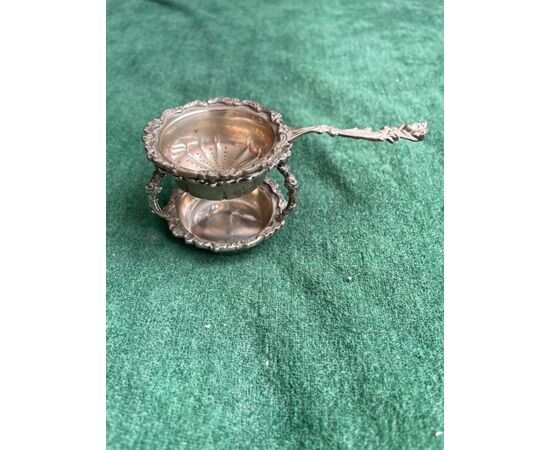 Silver colander with tray, pods, rocaille and angel motifs Italy.     