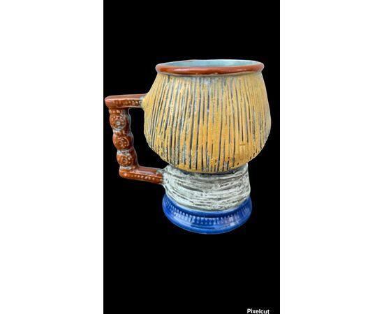 Serie di 4 boccali in grès a forma di teste di personaggi.firma S.Orvis Capodimonte.