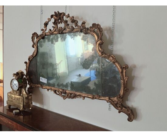 Specchiera orizzontale in legno dorato con fregi 
