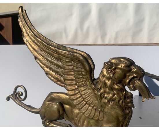 Pair of gilded bronze fire dogs. France, early 19th century.