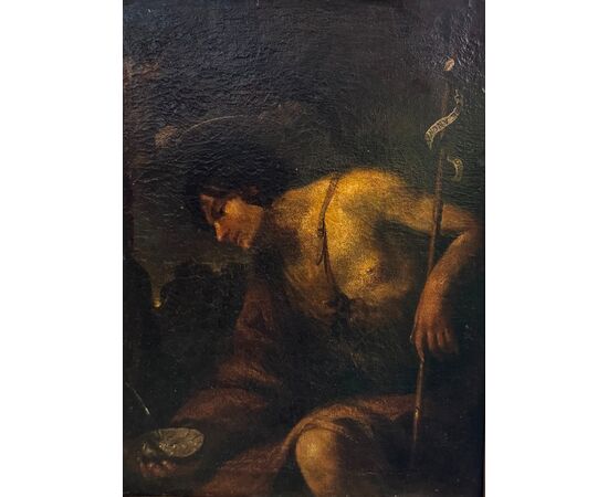 Saint John the Baptist in the desert, an oil painting on canvas from the 17th century.
