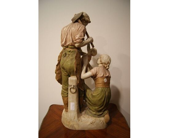 Antique large Royal Dux Bohemia porcelain sculpture from the 1800s depicting a traditional family