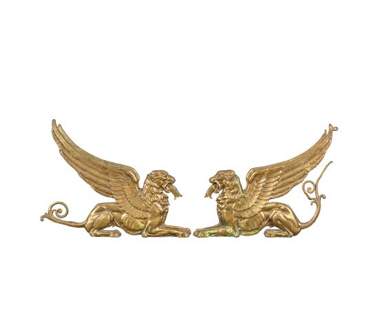 Pair of gilded bronze fire dogs. France, early 19th century.