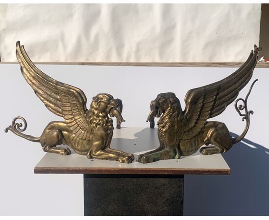 Pair of gilded bronze fire dogs. France, early 19th century.