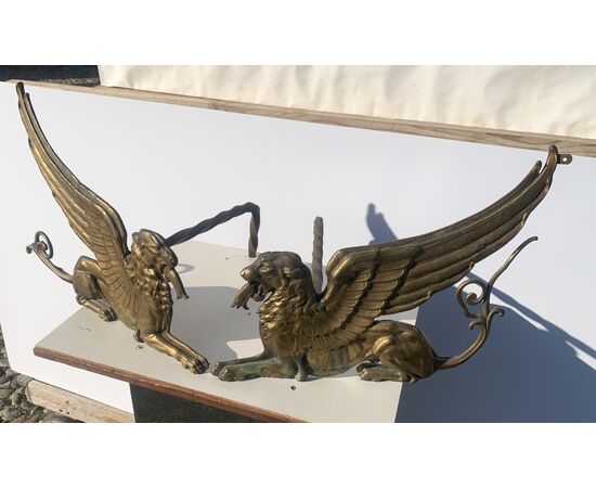 Pair of gilded bronze fire dogs. France, early 19th century.