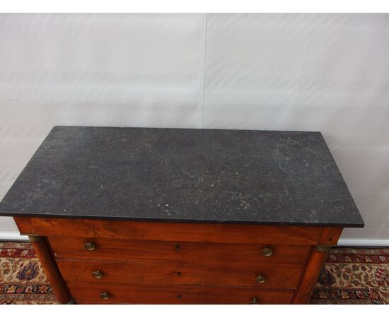 Empire style walnut chest of drawers with black marble, 19th century