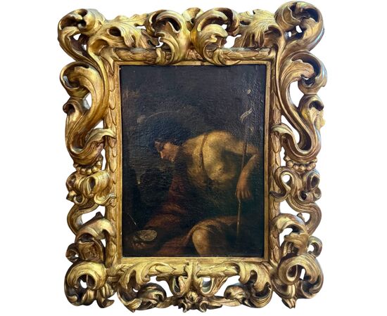 Saint John the Baptist in the desert, an oil painting on canvas from the 17th century.