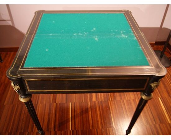 Antique French Boulle style game table from the 1800s in ebonized wood with brass inlays and bronzes