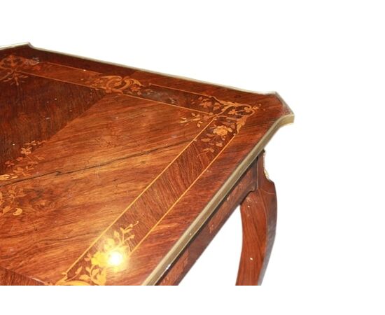 French Louis XV style desk from the 1800s with bronzes and rich marquetry motifs