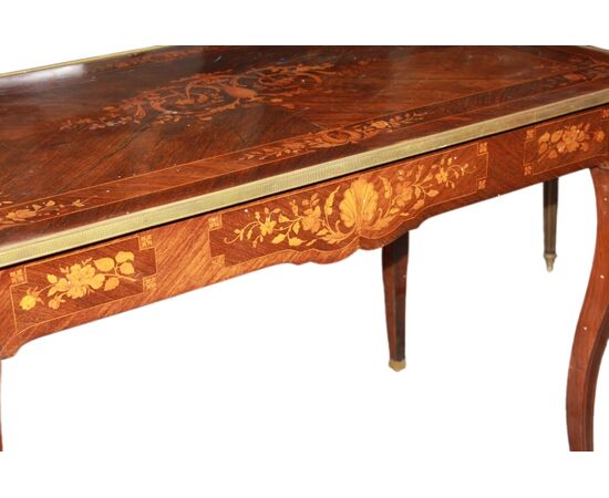 French Louis XV style desk from the 1800s with bronzes and rich marquetry motifs