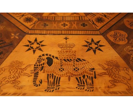 Antique English table with exotic taste from the 1800s, richly inlaid with animals and figures