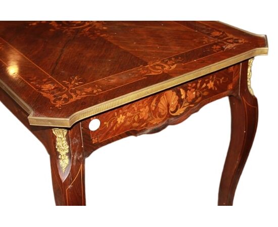 French Louis XV style desk from the 1800s with bronzes and rich marquetry motifs