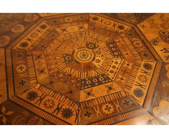 Antique English table with exotic taste from the 1800s, richly inlaid with animals and figures