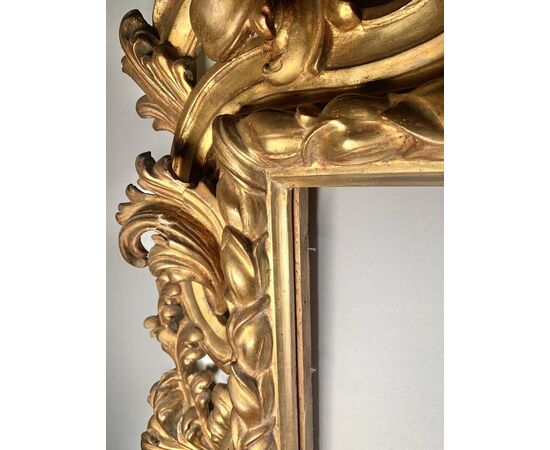 Large Baroque style frame in carved and gilded wood. Bologna, late 19th century.