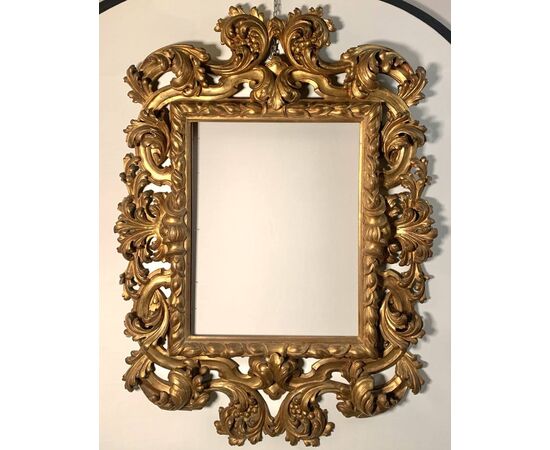 Large Baroque style frame in carved and gilded wood. Bologna, late 19th century.