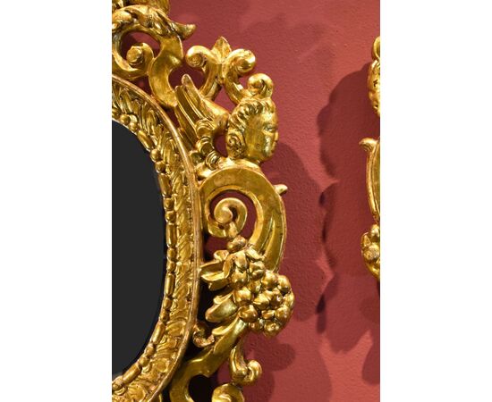 Pair of carved and gilded mirrors 'alla Sansovino', Venice 18th century