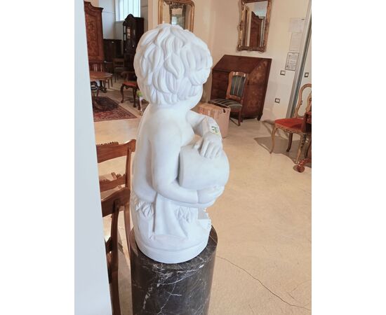 Gray marble column with white marble cherub statue