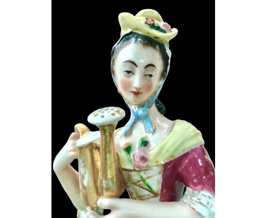 Polychrome porcelain veilleuse-teapoy depicting a lady with watering can. France